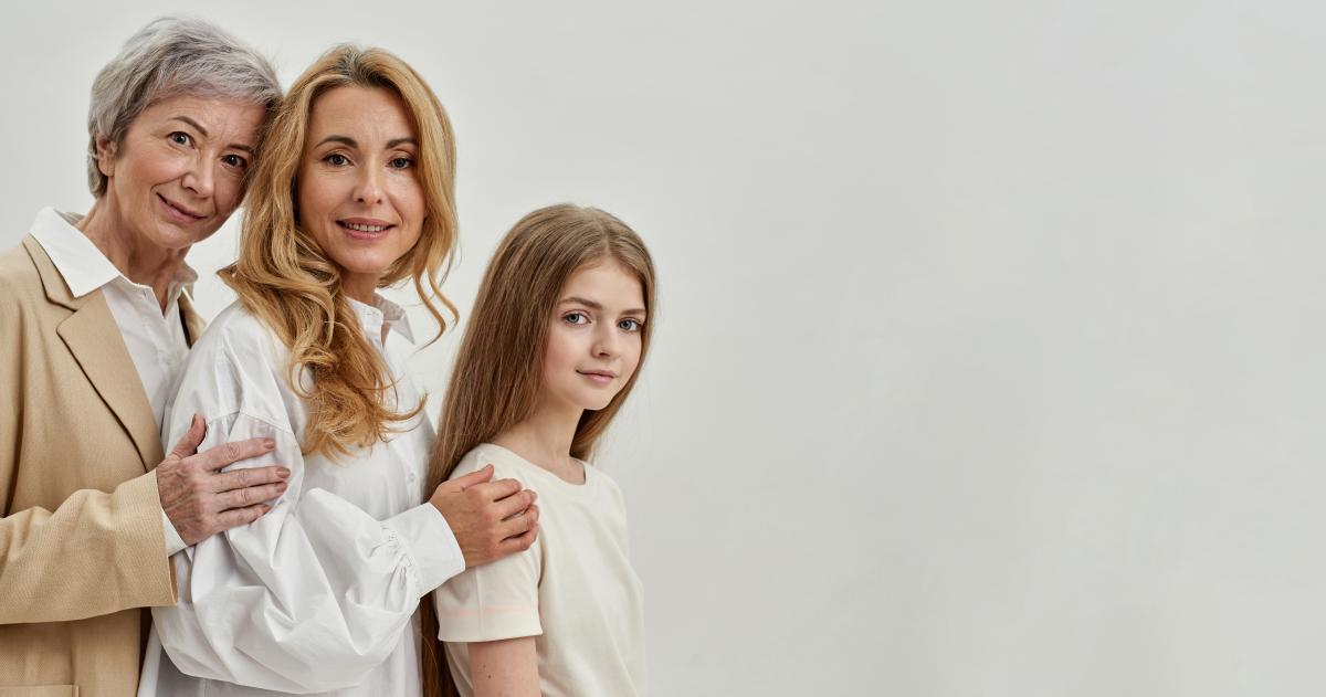 Three generations of women standing together