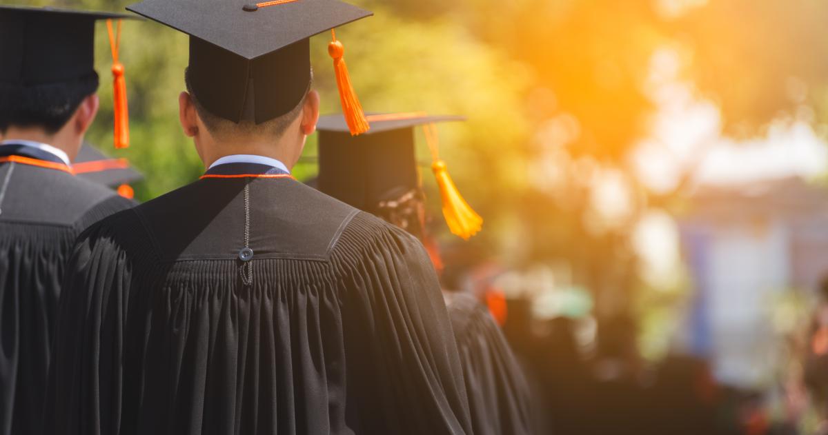 Graduate wearing cap and gown