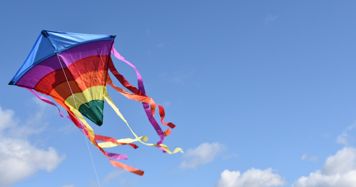 A picture of a colorful kite in the air