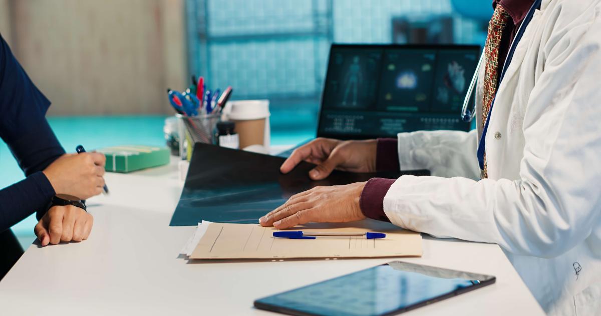 A physician and advisor meeting and planning