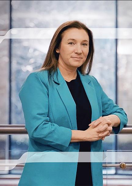 Dr. Kourtney Kemp leaning on a railing