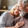 An older couple laughing together