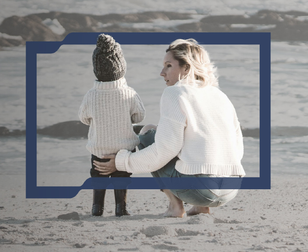 A woman with a child at the beach