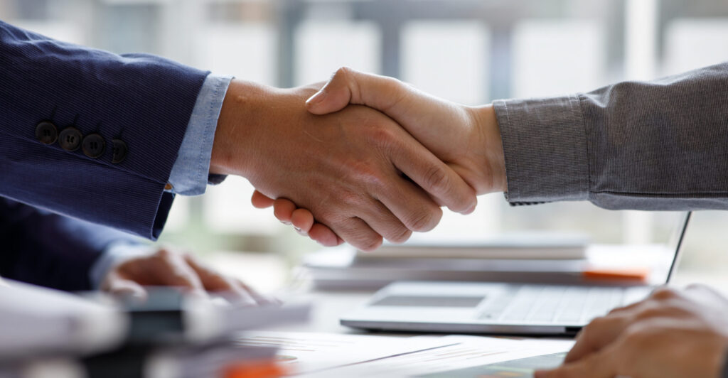 two people shaking hands