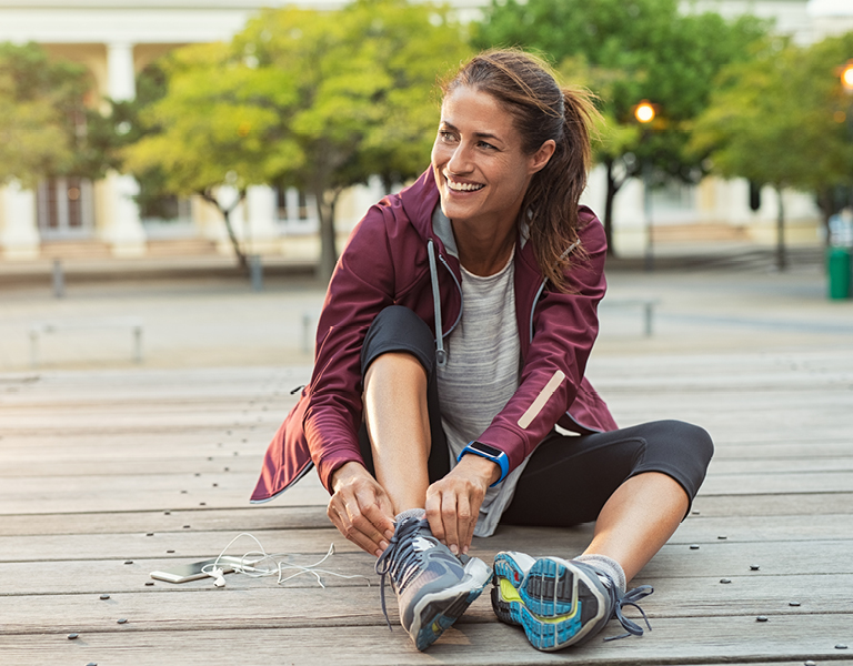 Woman preparing for a run, symbolizing a thoughtful approach to financial planning